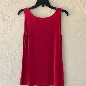 Long tank top by Travelers Chico’s Sleeveless and lighter in front than in back.